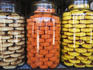 Glass jars with cookies in Kumily market.
