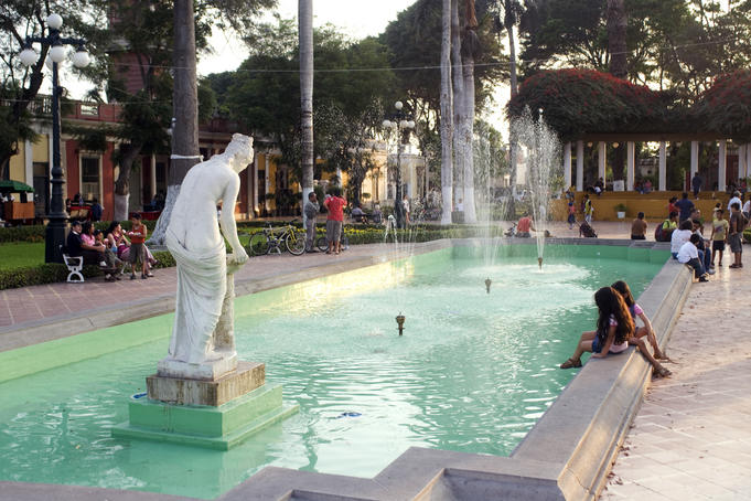 Girls playing by fountain, Barranco.