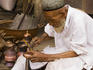 Uighur coppersmith at work.