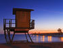 Lifeguard hut and municipal pier at sunset.