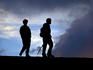 Two men hiking to Pacaya volcano.