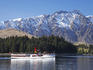 TSS Earnslaw sailing on Lake Wakatipu, with The Remarkables in background.