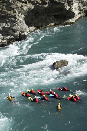River surfing on the Kawarau River, Kawarau Gorge at Roaring Meg.