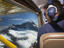 Cockpit of small plane over Milford Sound.