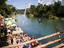 Tourists by river, Laos