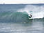 Surfer on wave off Durban pier