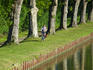 Cyclist on bank of canal at Rogny-les-Sept-
