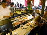 Tucking into sushi at the sushi bar in Cafe O'Lei, Kihei, South West Maui.