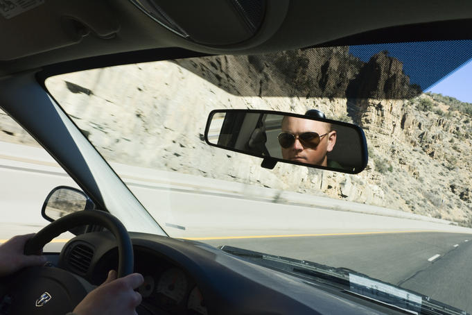 Man behind the wheel, driving along Highway 50.