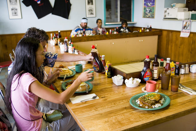 Tucking into breakfast at the Hawaiian Style Cafe, Waimea. Waimea Region.