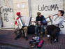 Street musicians performing at Sunday San Telmo market, Avenida Defensa.