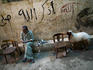 Man smoking a shisha pipe near Darb al-Ahmar street in the old city, Cairo