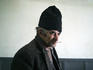 Gypsy man smoking in a bar in Transylvania.