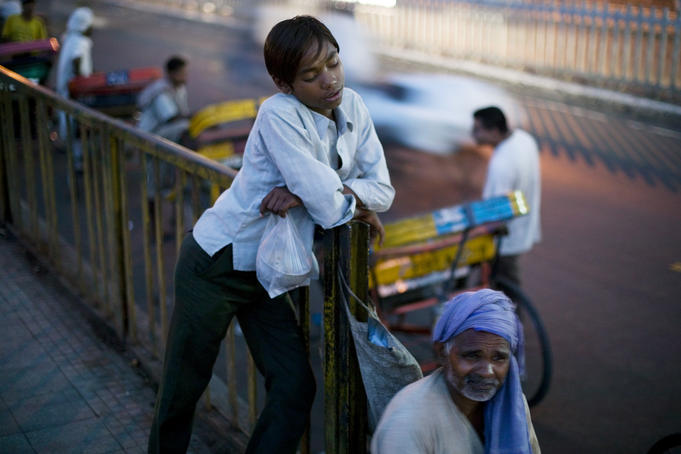 Rickshaw pullers having a break on streets of Delhi.