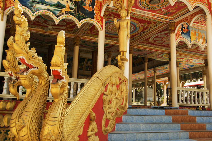 Gold nagas at the entrance to a Buddhist monastery.