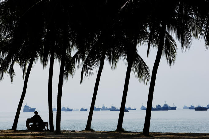 Relaxing under palm trees at East Coast Park.