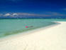 Snorkelling in the clear azure waters at a beach in Malaysian Borneo's Sipadan-Kapali-Mabul region.