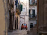 Fiat 500 Bambino car in back streets of Giovinazzo Vecchio (old town).