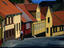 Postman delivering mail to houses.