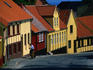 Postman delivering mail to houses.
