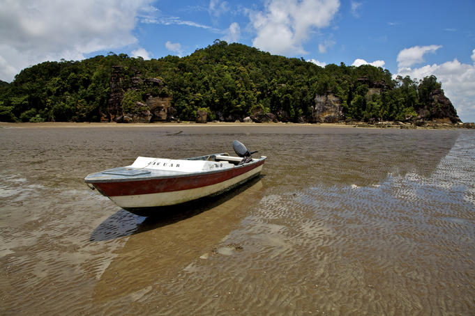 Boat beached on the mud at low tide.