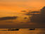 Boats off Rai Leh West Beach under a golden light.