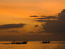 Boats off Rai Leh West Beach under a golden light.