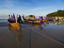 Wooden boats moored on shore of Karon Beach.