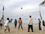 Volleyball game on the beach.