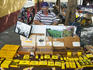 Cigar maker at his market stall.
