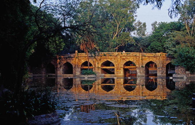 Eight tiered, 16th century stone bridge called Athpula in Lodi Gardens.