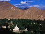 Stupa and ridge with palace and Namgyal Tsemo Monastery.