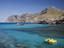 Paddleboat and luxury yacht in Cala Sant Vicenc bay.