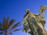 Statue of philosopher Ramon Llull in twilight.