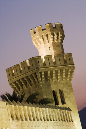 Tower of Almudaina Palace at dusk.