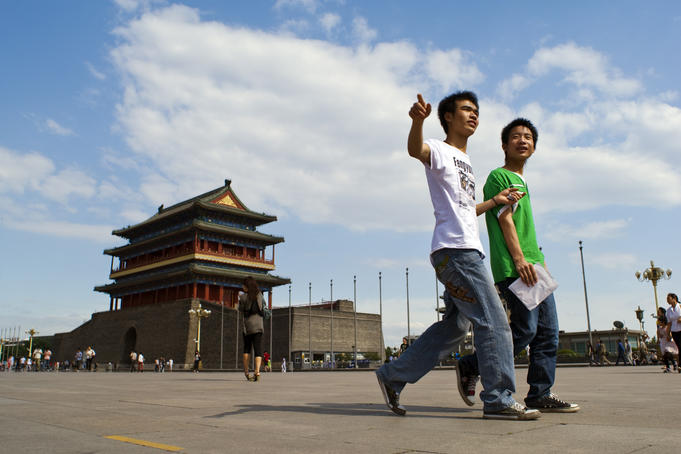 Front Gate, with two young men walking by.