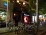 Entrance to Propaganda, with bicycles parked outside.