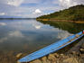 Longboat along the shore of Lake Batang Ai.