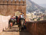 Tourists arrive by elephant at Amber Palace.