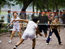 Playing badminton beside Hoan Kiem Lake.