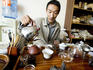 Man preparing tea in tea shop.