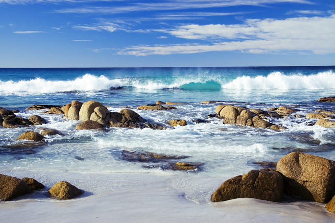 Wave breaking onto rocky shore at Friendly Beaches.