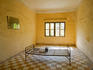 Prison cell at Tuol Sleng Genocide Museum.
