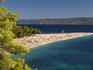 Zlatni Rat beach and sunbathers.