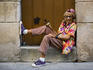 Eccentric Cuban woman posing with a cigar.