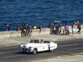 People relaxing and enjoying the afternoon sun along the Malecon.