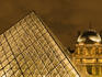 Musee du Louvre pyramid at dusk.