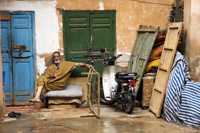 Moroccan man relaxing in the backstreets of Marrakesh.