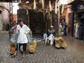 Shopkepper and his son outside their medicine shop selling natural remedies.