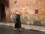 Man hurrying through backstreets of the Marrakesh medina.